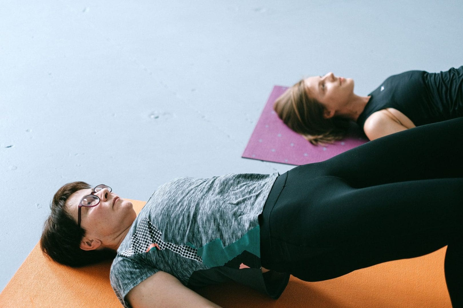 Meredith and Sarah of Dynamic Physical Therapy Chicago demonstrating a bridge exercise for pelvic floor physical therapy